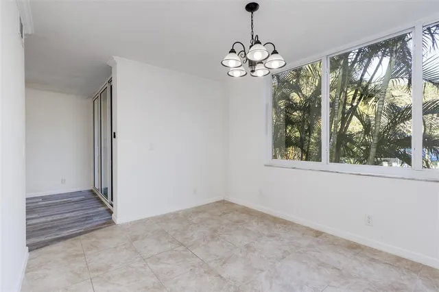 a kitchen with granite countertop a sink stainless steel appliances and cabinets