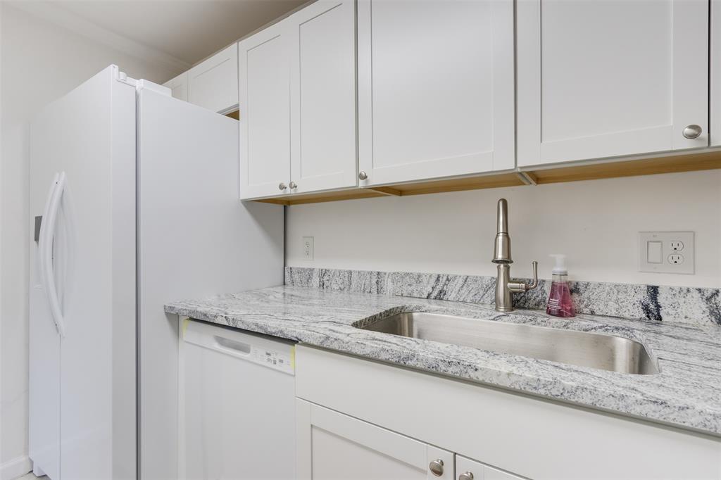 9410 Live Oak Place, Unit 203 Davie, FL 33324 - Photo 14 of 40 a kitchen with granite countertop a sink and cabinets