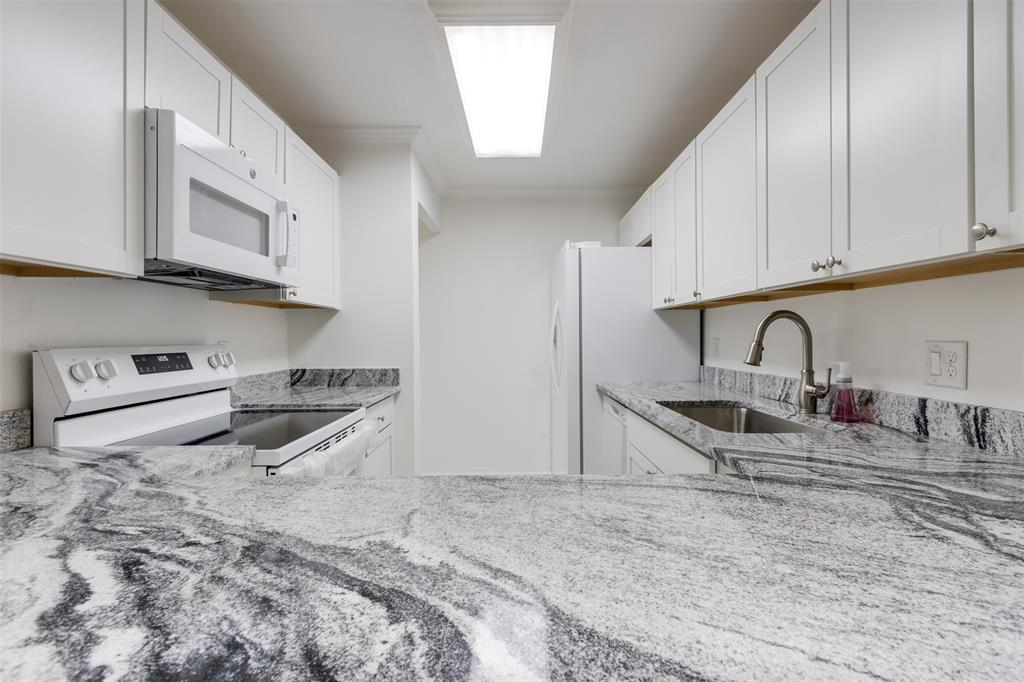 9410 Live Oak Place, Unit 203 Davie, FL 33324 - Photo 15 of 40 a kitchen with stainless steel appliances granite countertop a stove a sink and a refrigerator