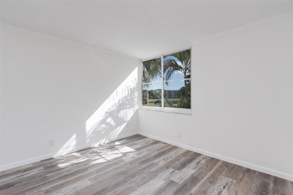 9410 Live Oak Place, Unit 203 Davie, FL 33324 - Photo 22 of 40 a view of entryway and hall with wooden floor