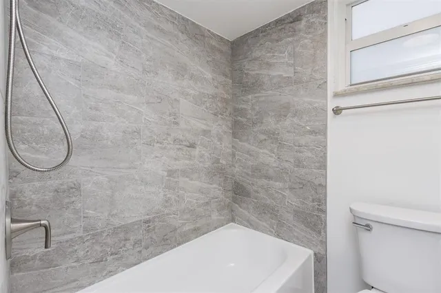 a view of a bathroom from the hallway