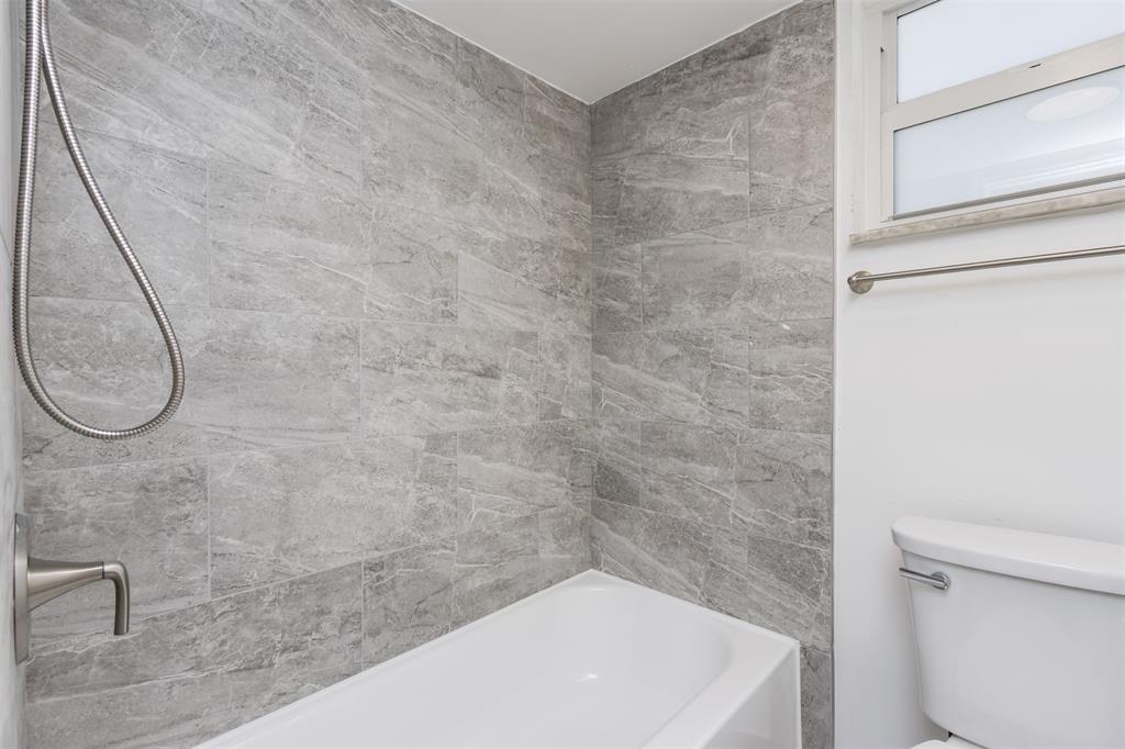 9410 Live Oak Place, Unit 203 Davie, FL 33324 - Photo 27 of 40 a bathroom with a white bath tub and a shower