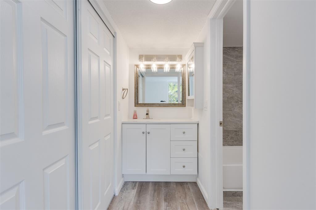9410 Live Oak Place, Unit 203 Davie, FL 33324 - Photo 28 of 40 a view of a bathroom from the hallway