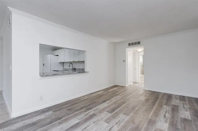 a view of kitchen with wooden floor