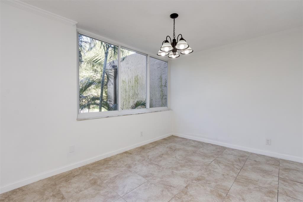 9410 Live Oak Place, Unit 203 Davie, FL 33324 - Photo 8 of 40 an empty room with a window