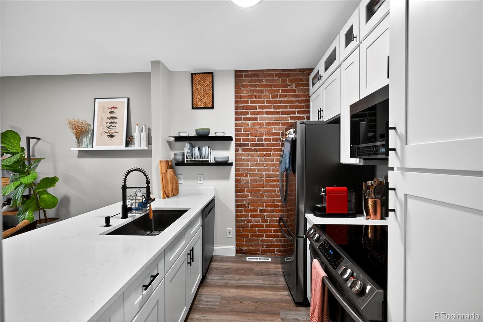 726 Fox Street Denver, CO 80204 - Photo 14 of 33 a kitchen with a sink and a refrigerator