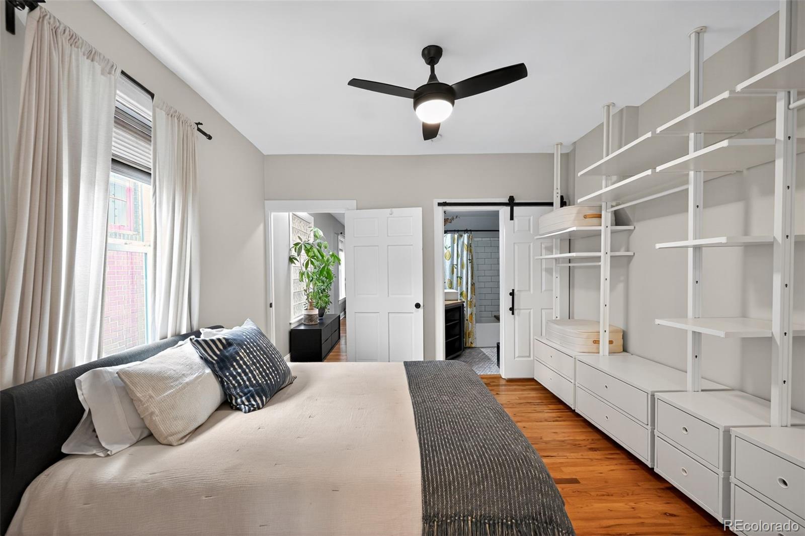 726 Fox Street Denver, CO 80204 - Photo 16 of 33 a bedroom with a large bed and a window