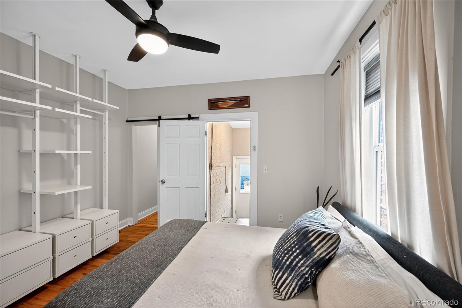 726 Fox Street Denver, CO 80204 - Photo 17 of 33 a bedroom with a bed and a window