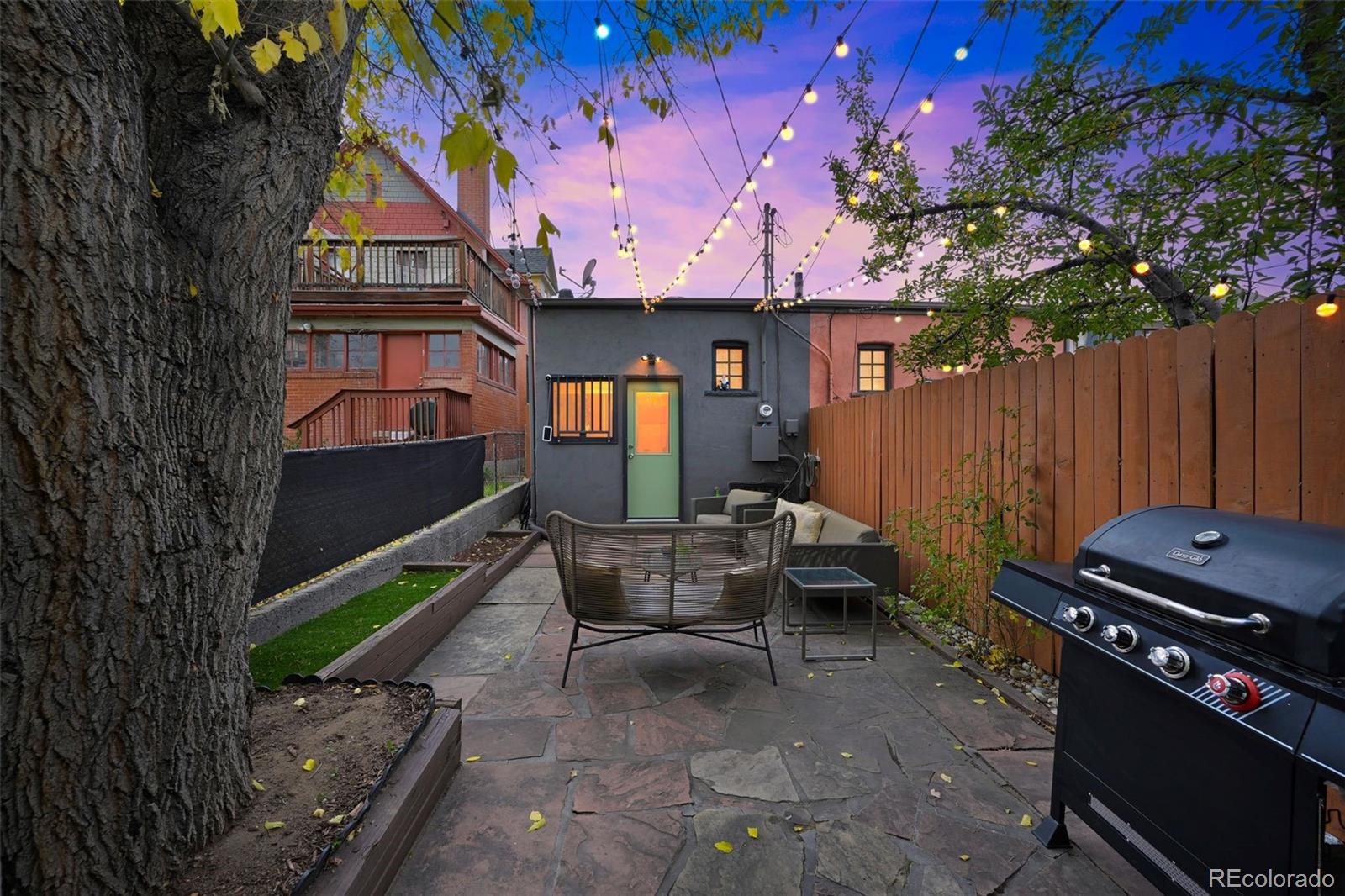 726 Fox Street Denver, CO 80204 - Photo 28 of 33 a backyard of a house with outdoor seating