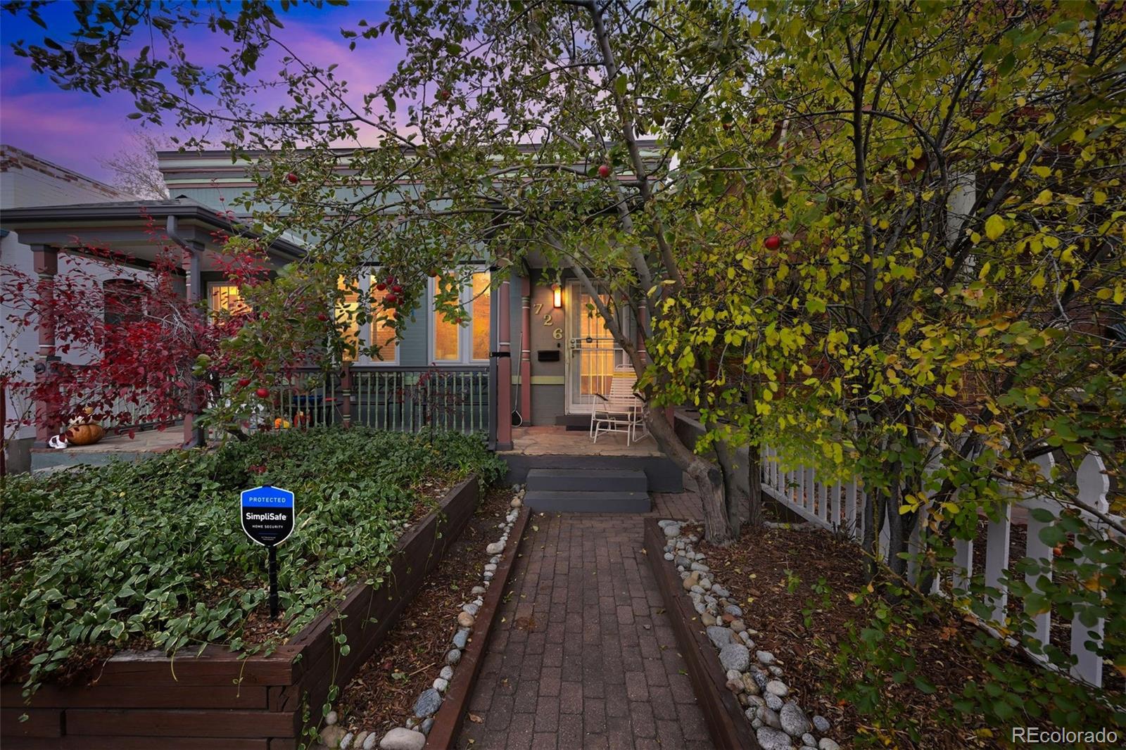 726 Fox Street Denver, CO 80204 - Photo 32 of 33 a front view of a house with a yard
