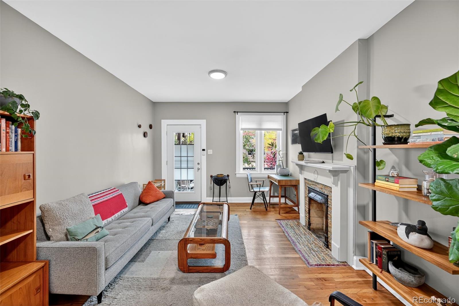 726 Fox Street Denver, CO 80204 - Photo 7 of 33 a living room with furniture and a fireplace