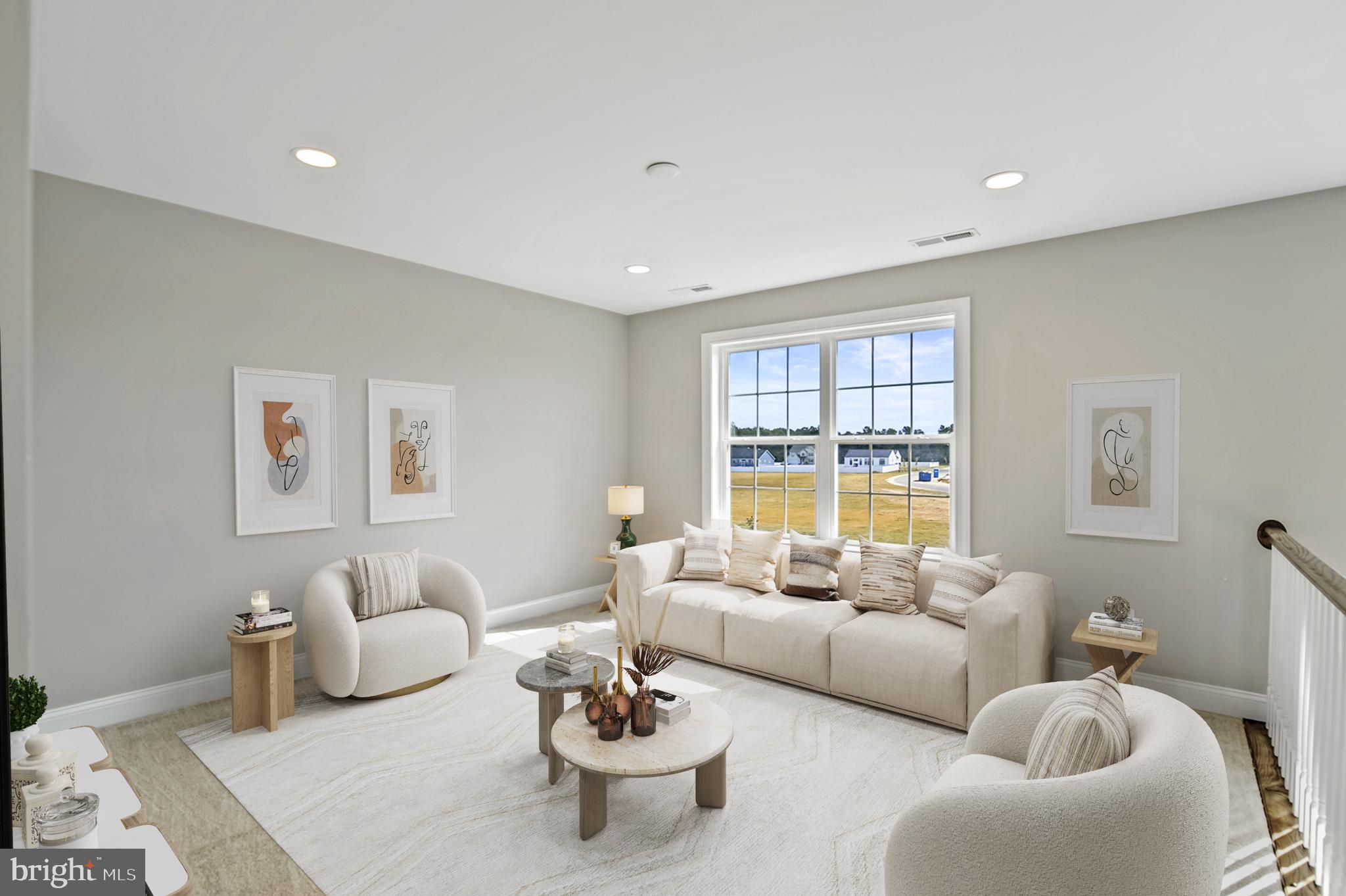 296 Robbins Road, Unit GEO Frederica, DE 19946 - Photo 11 of 16 a living room with furniture and a large window