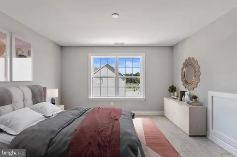 a bed room with a bed and a window