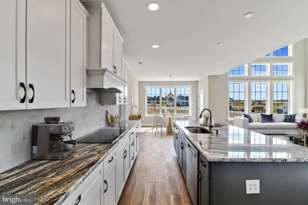 a kitchen with counter top space a sink and cabinets