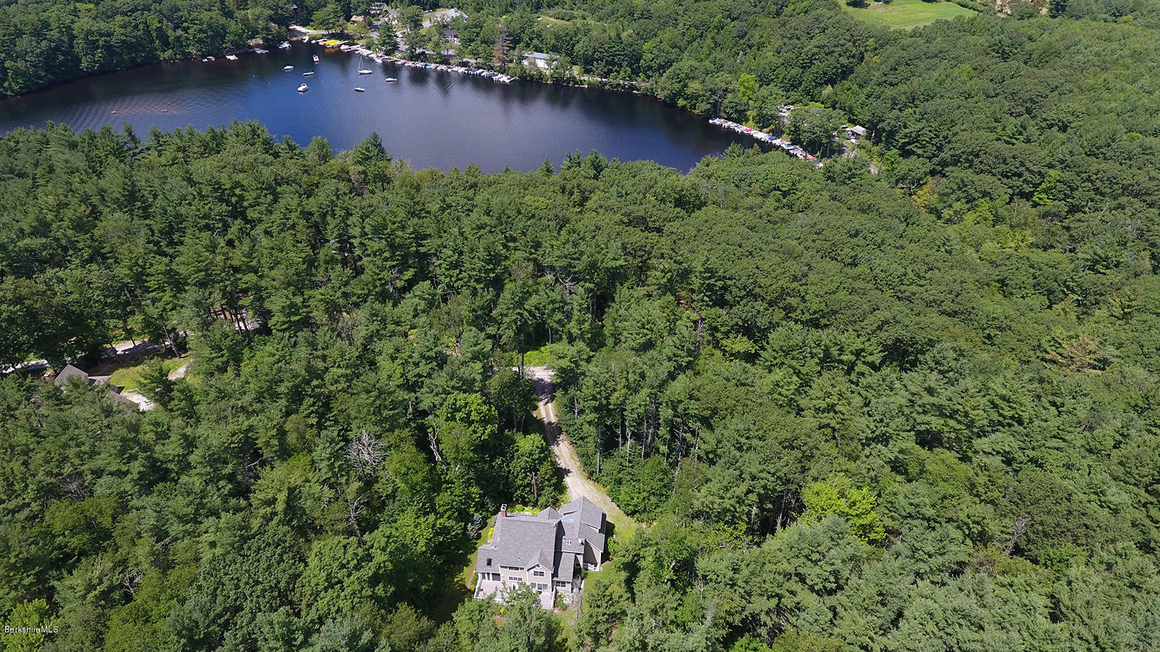 113 Pike Road Otis, MA 01253 - Photo 1 of 2 an aerial view of a house with swimming pool and outdoor seating