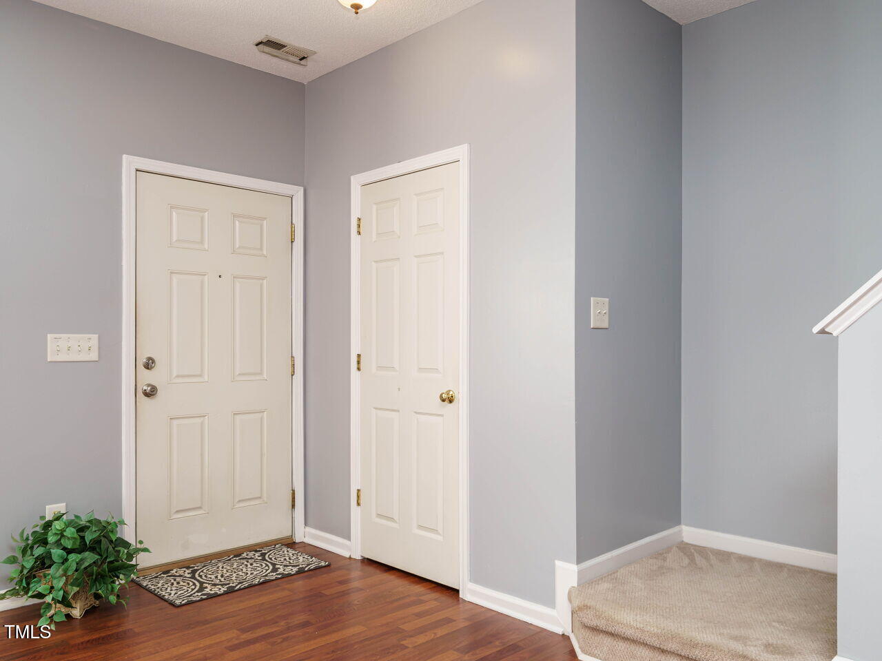125 Watertree Lane Apex, NC 27502 - Photo 11 of 32 an empty room with wooden floor and closet