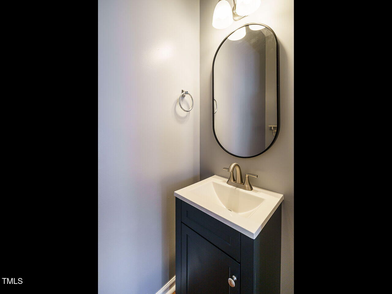 125 Watertree Lane Apex, NC 27502 - Photo 12 of 32 a bathroom with a sink and a mirror