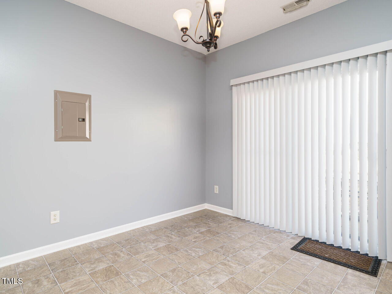 125 Watertree Lane Apex, NC 27502 - Photo 13 of 32 a view of a livingroom with a chandelier fan