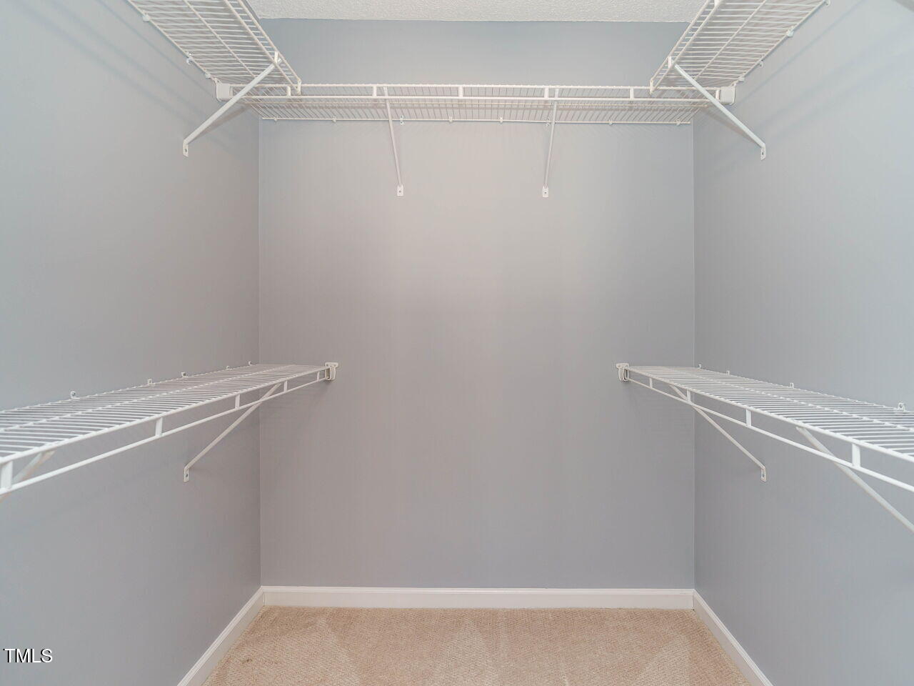125 Watertree Lane Apex, NC 27502 - Photo 20 of 32 a view of a room with racks on the wall