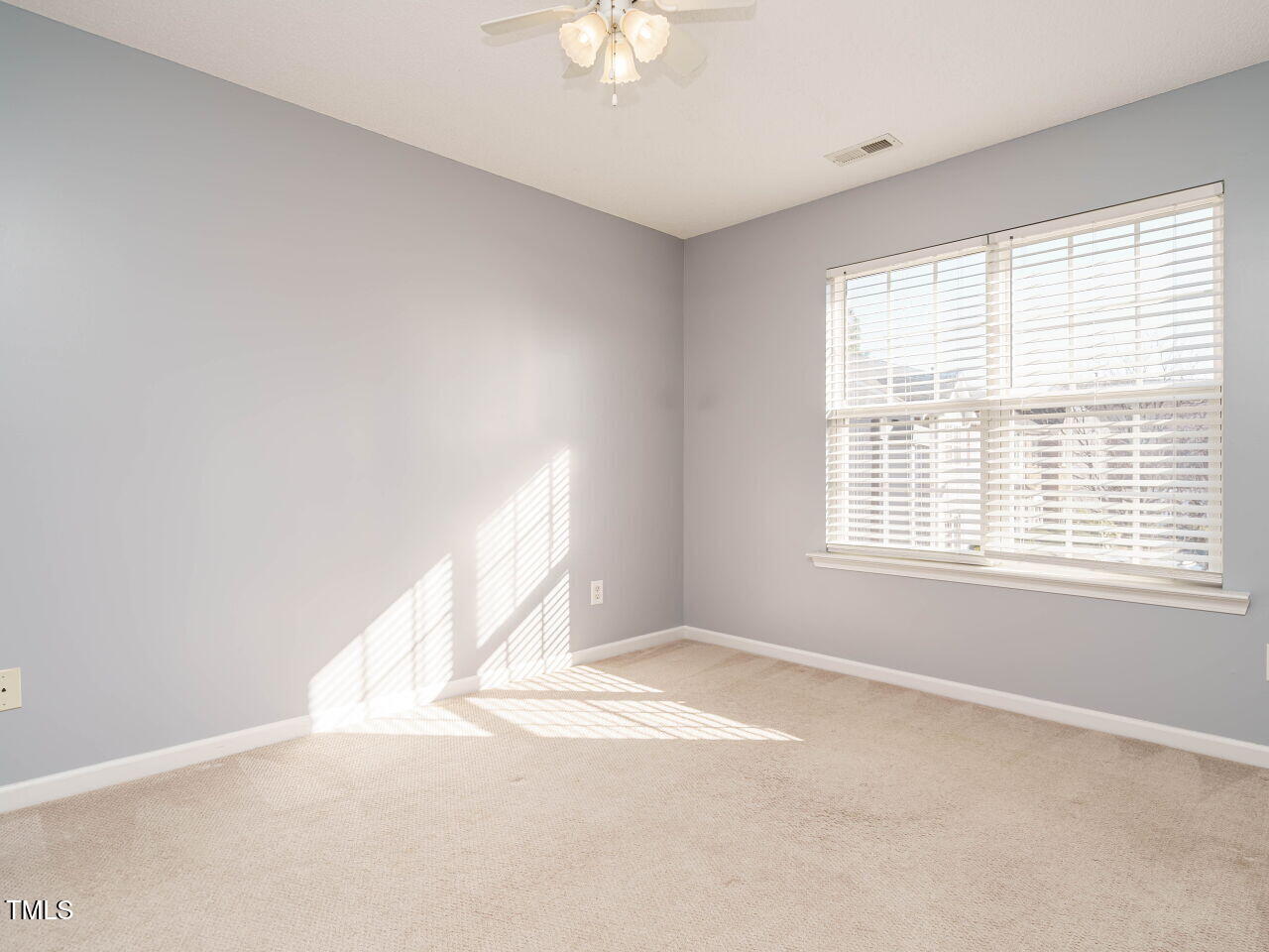 125 Watertree Lane Apex, NC 27502 - Photo 26 of 32 a view of an empty room with a window