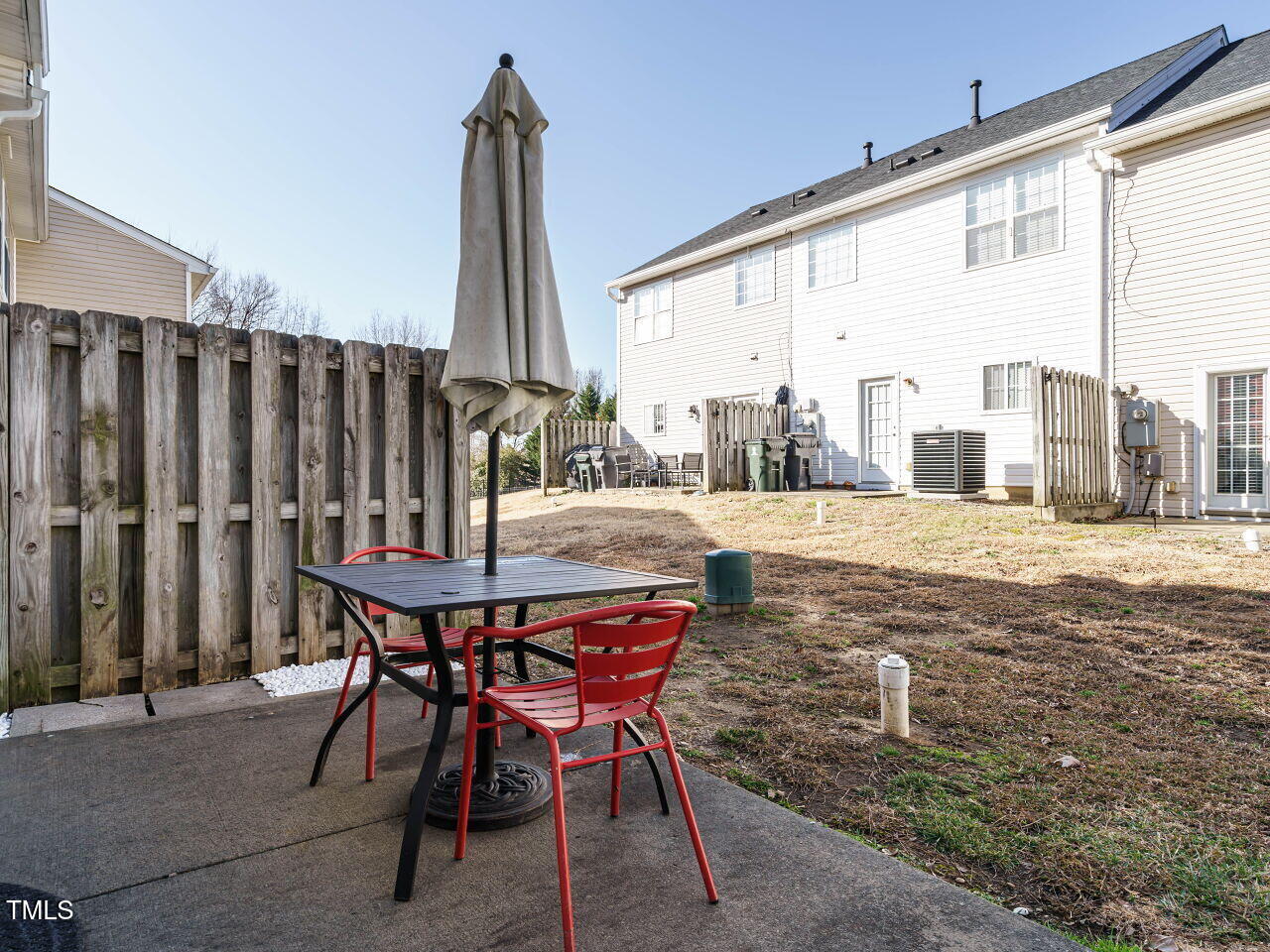 125 Watertree Lane Apex, NC 27502 - Photo 27 of 32 a view of balcony with chairs and wooden fence