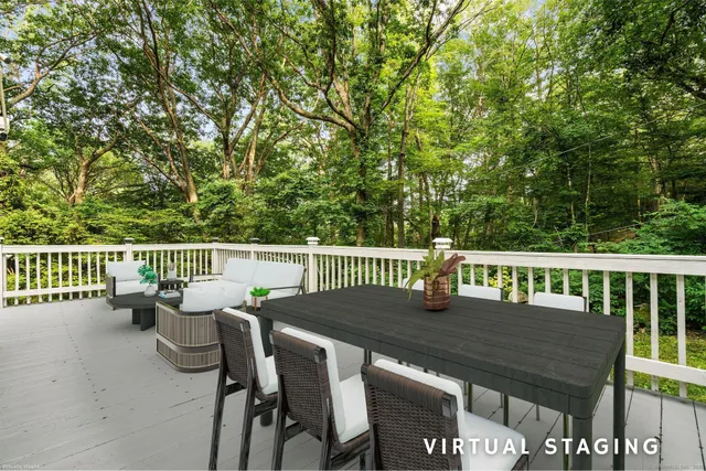a view of a chairs and table on the deck