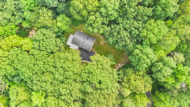 a backyard of a house with lots of green space