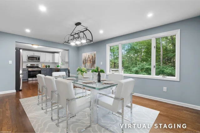 a view of a dining room with furniture window and outside view