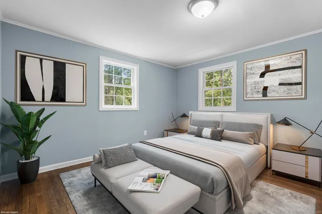 a bedroom with bed and a window