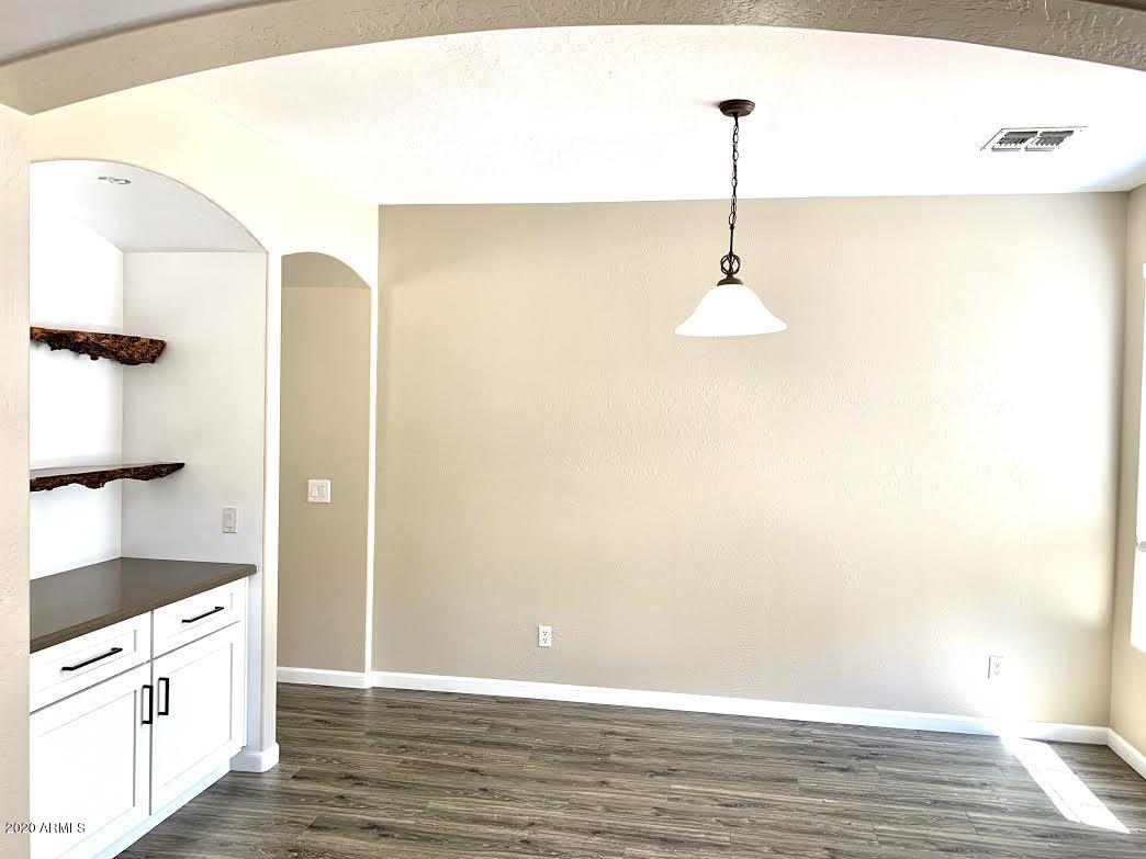 140 West Cardinal Way Chandler, AZ 85286 - Photo 13 of 44 a view of a kitchen cabinets and wooden floor