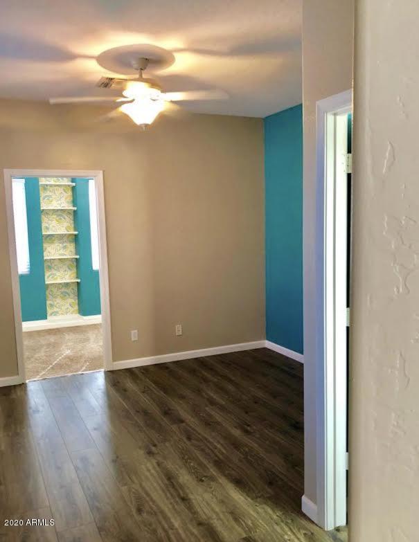 140 West Cardinal Way Chandler, AZ 85286 - Photo 19 of 44 an empty room with wooden floor and windows