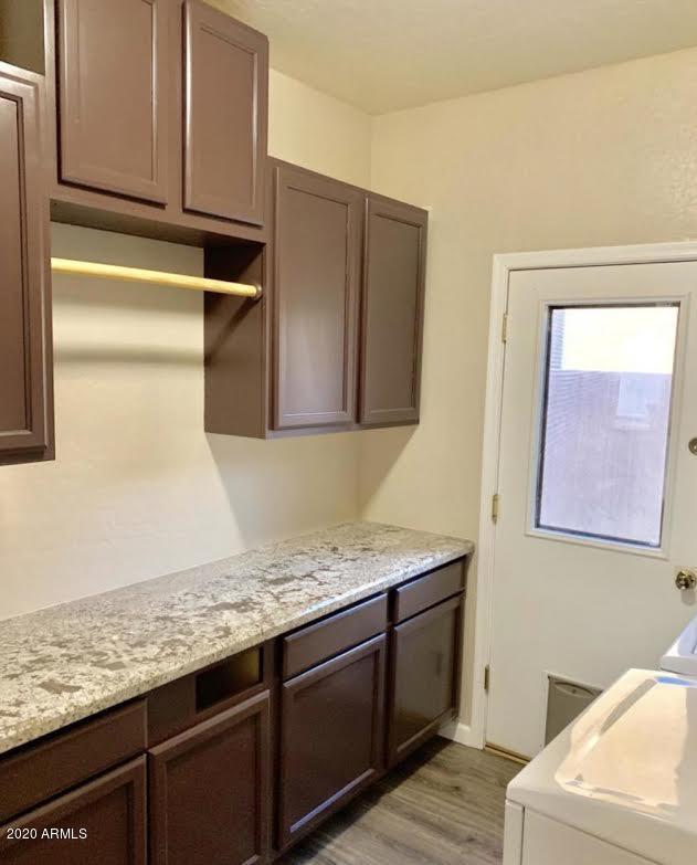 140 West Cardinal Way Chandler, AZ 85286 - Photo 37 of 44 a bathroom with a granite countertop sink and a mirror