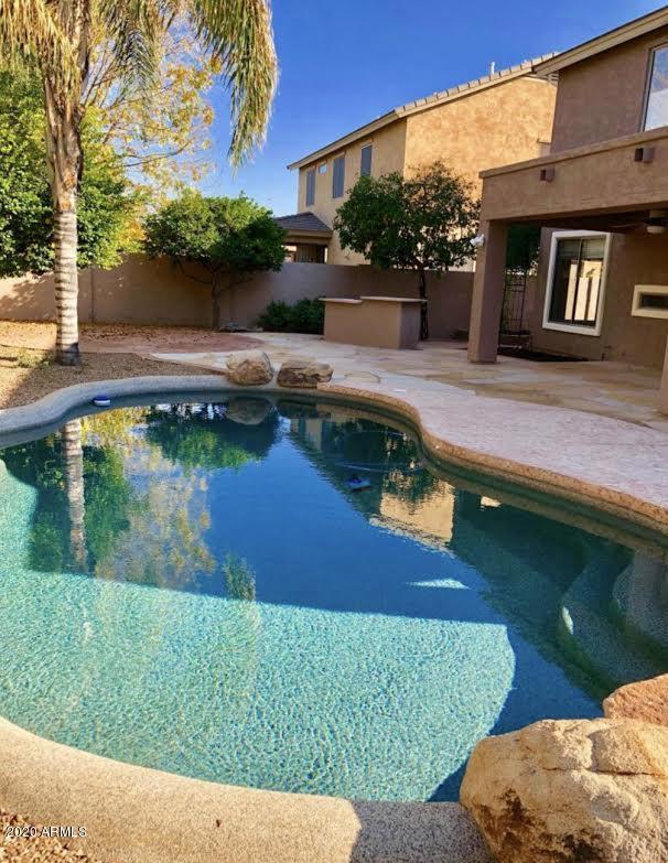 140 West Cardinal Way Chandler, AZ 85286 - Photo 39 of 44 a swimming pool with outdoor seating and yard