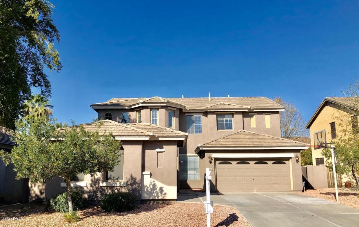 140 West Cardinal Way Chandler, AZ 85286 - Photo 44 of 44 a front view of a house with a yard
