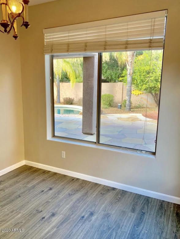 140 West Cardinal Way Chandler, AZ 85286 - Photo 6 of 44 a view of empty room with wooden floor and fan