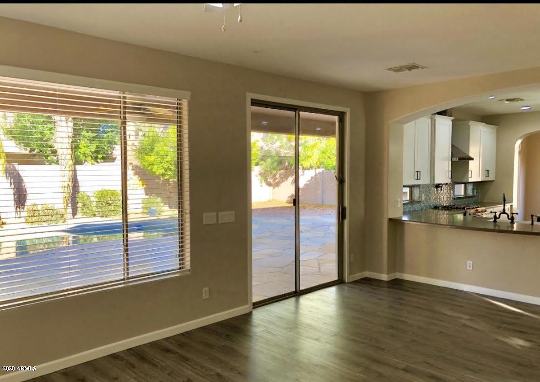 140 West Cardinal Way Chandler, AZ 85286 - Photo 10 of 44 a view of a kitchen with wooden floor and a window