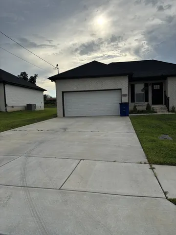 a house view with a garden space