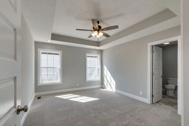 a view of livingroom with hardwood floor and ceiling fan