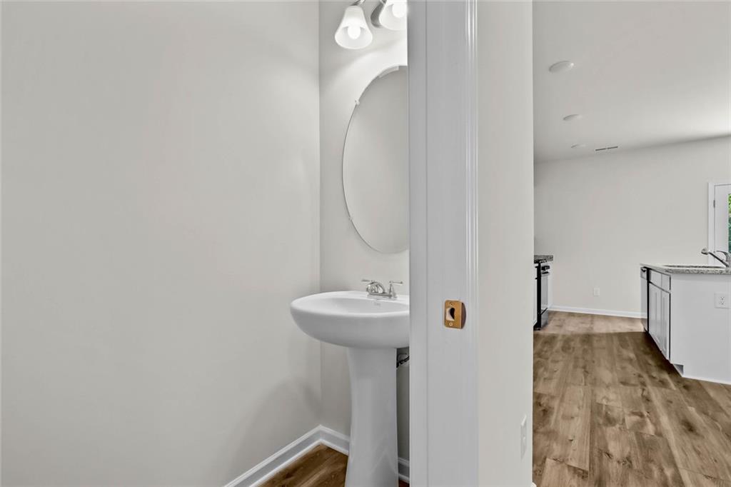 6 Cavalier Court Rome, GA 30165 - Photo 16 of 30 a bathroom with a sink and a mirror