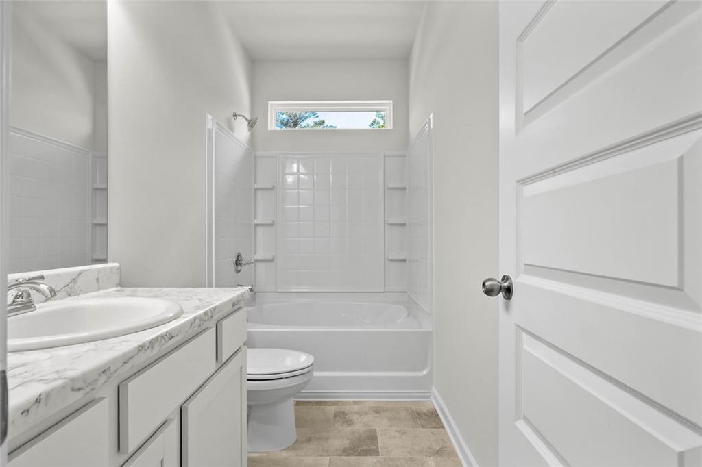 6 Cavalier Court Rome, GA 30165 - Photo 23 of 30 a bathroom with a sink a toilet and shower