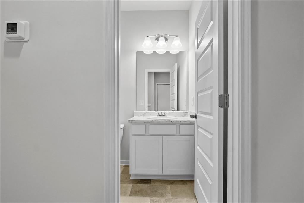 6 Cavalier Court Rome, GA 30165 - Photo 28 of 30 a bathroom with a sink and a mirror