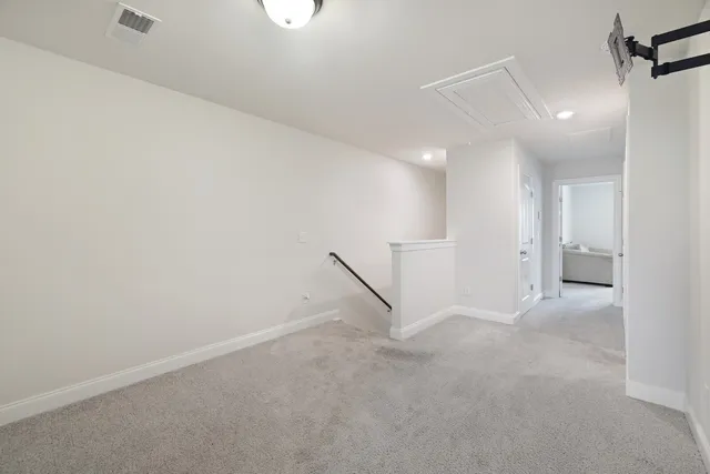 an empty room with white walls and white walls
