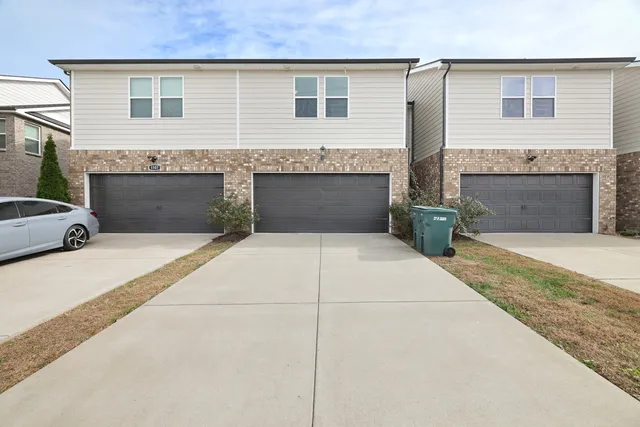 a front view of a house with yard