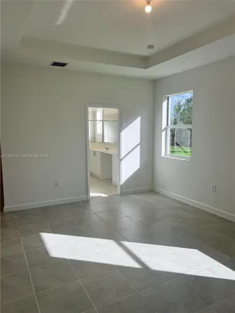 a room with a mirror and a shower