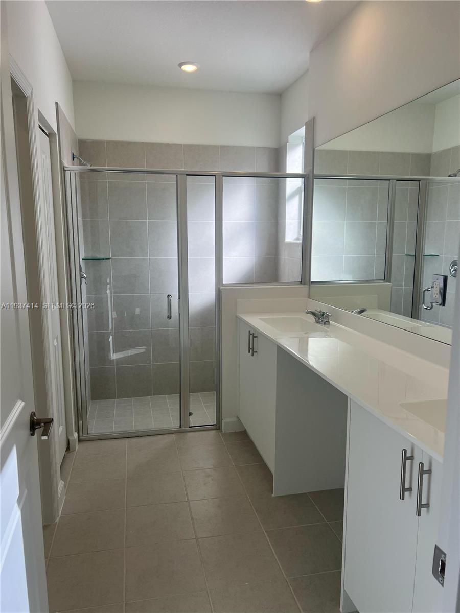 2422 Southeast 30th Street Homestead, FL 33035 - Photo 14 of 36 a room with a mirror and a shower