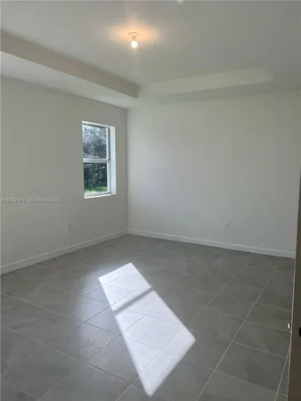 a bathroom with a shower a sink a toilet and mirror