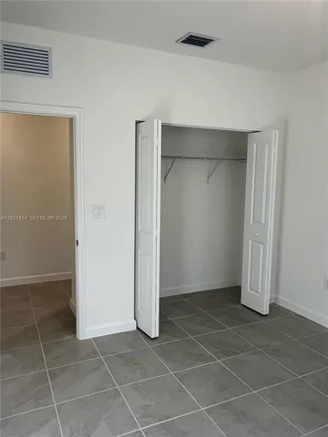 a kitchen with appliances a sink and cabinets
