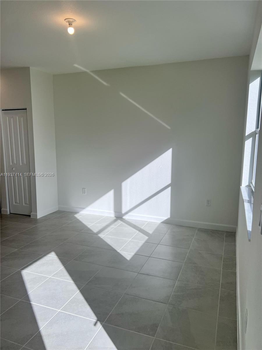 2422 Southeast 30th Street Homestead, FL 33035 - Photo 23 of 36 a view of an empty room with a window