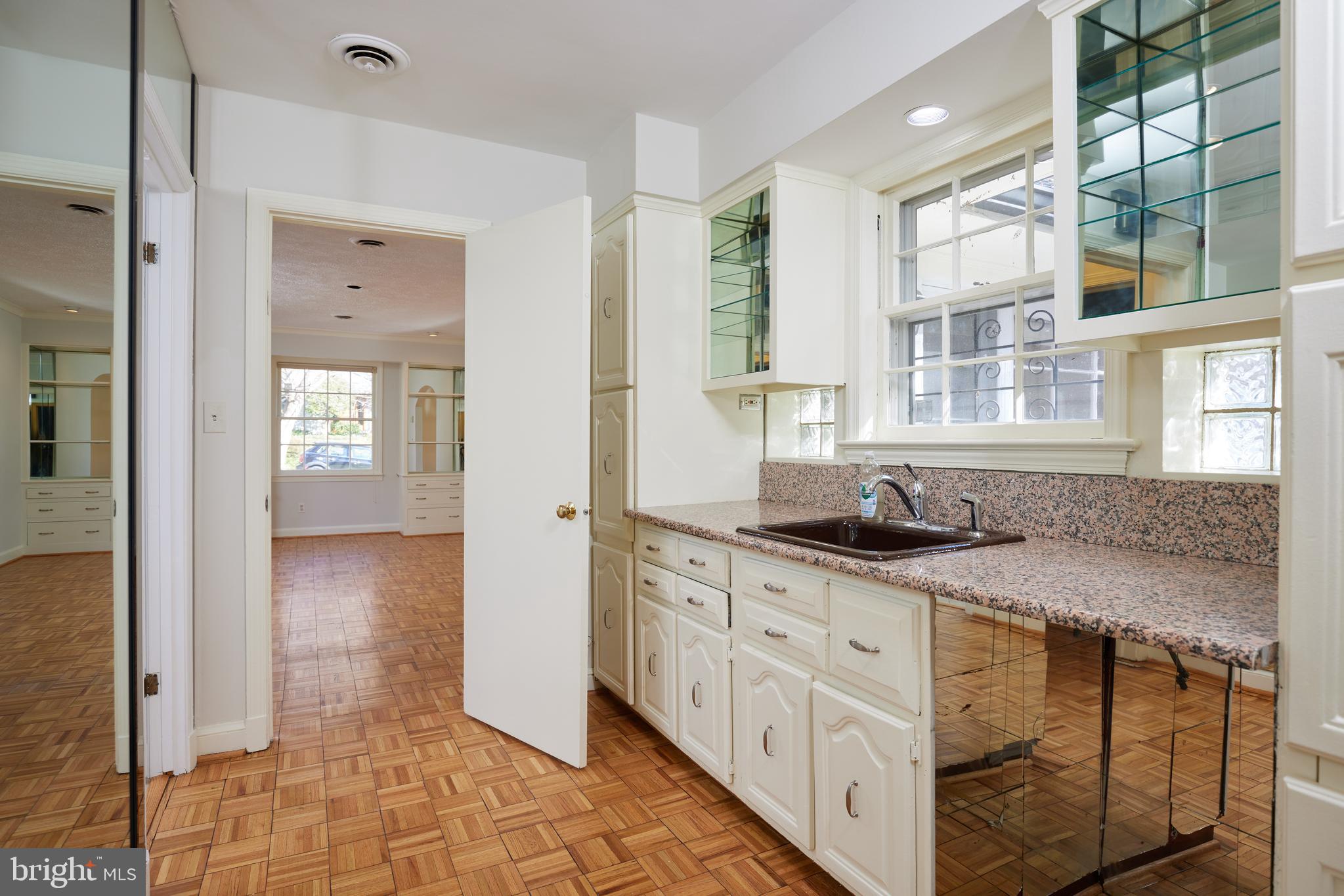 5310 Oakland Road Chevy Chase, MD 20815 - Photo 15 of 45 a bathroom with granite countertop a sink and a window