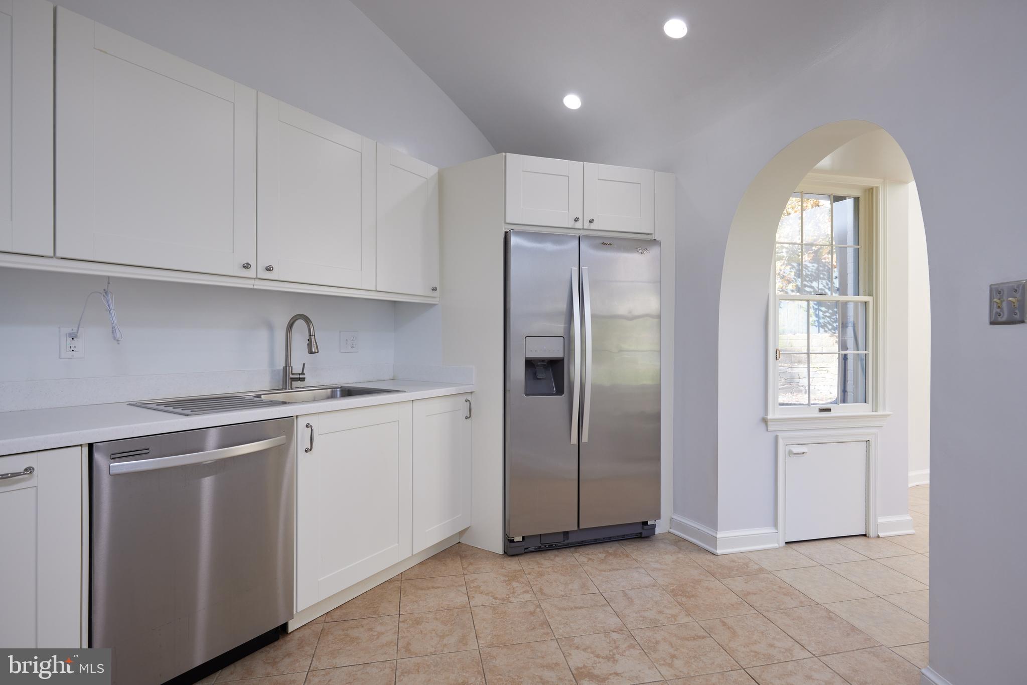 5310 Oakland Road Chevy Chase, MD 20815 - Photo 17 of 45 a kitchen with stainless steel appliances granite countertop a refrigerator and a sink
